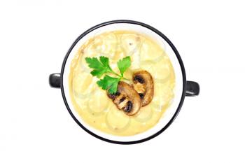Soup-puree mushroom with champignons in bowl isolated on white background from above
