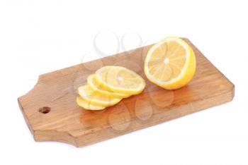 Royalty Free Photo of Lemons Sliced on a Cutting Board