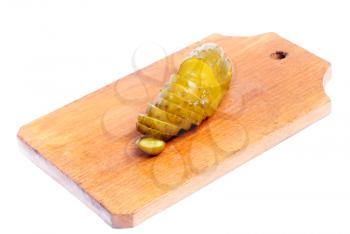 Royalty Free Photo of a Sliced Pickle on a Cutting Board