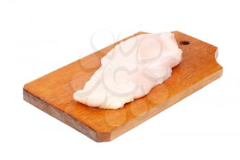 chicken meat sliced   on  cutting  board isolated  on  white  background