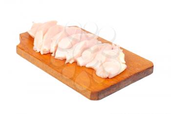 chicken meat sliced   on  cutting  board isolated  on  white  background