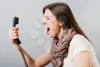 woman talking on landline