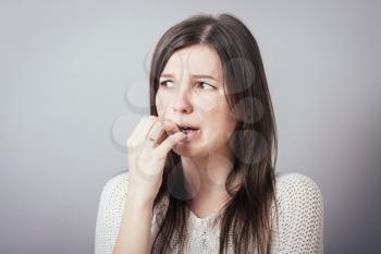 Girl bites his nails