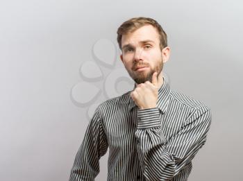 Fashion portrait of sexy young man in casual poses and looking at camera.