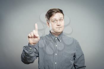 man pointing up with his index finger