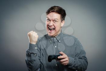Young man playing and wins the video games