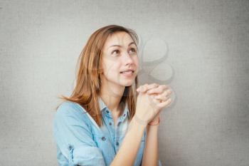 female gesture prayer, conversation with God. isolated on gray background
