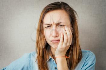 female  suffering bad toothache closeup