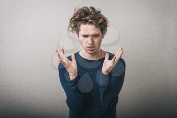 young man holding in his hands something invisible