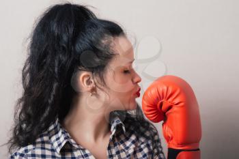 businesswoman with boxing gloves ready for fighting