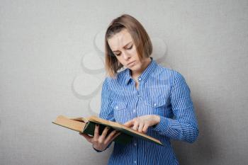 girl reading a book and watching your finger across the page