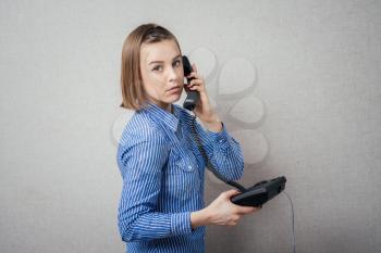 girl talking on landline phone