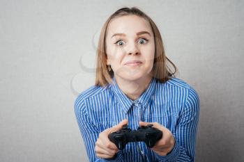 young girl relaxing and playing video games
