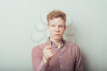 Closeup portrait happy young man giving thumb, finger fig gesture you are going to get zero nothing. Pozitive emotions, facial expressions, feelings, body language, signs