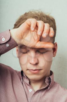 Tanned man having a headache