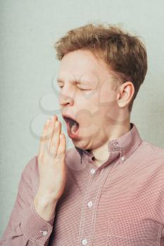 young man  yawning