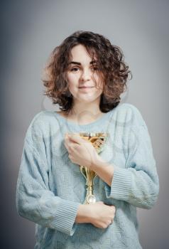 woman winning a trophy. Isolated