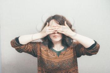 woman covering her eyes