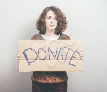 girl holding a sign Donations