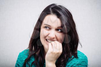 girl bites his nails