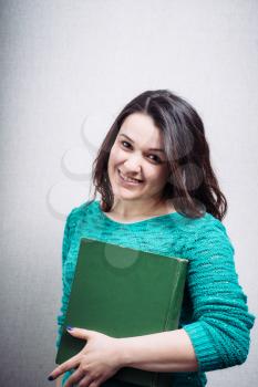 Student girl  smiling happy going back to school. female college or university student. young woman model holding books.