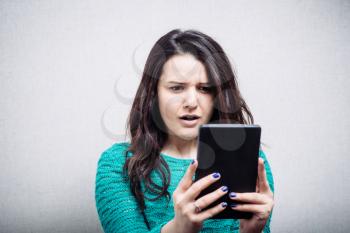 girl looking at mobile tablet