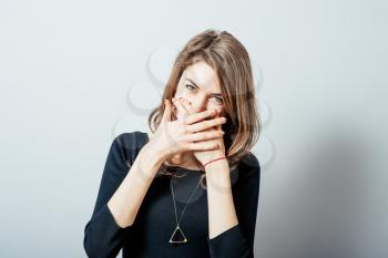 A young woman holding back vulgar jokes