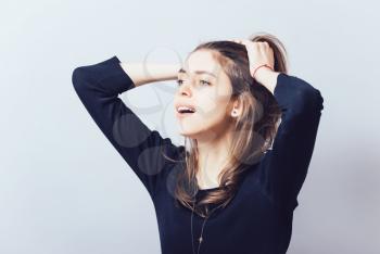 Woman with headache holding her hand to the head