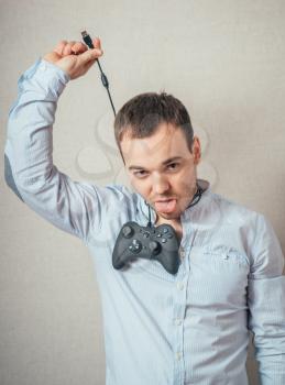  young man holding video game joystick.
