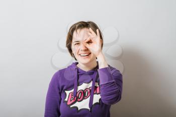 girl making binoculars hands