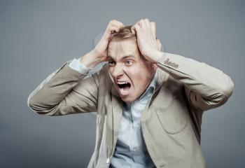 Closeup portrait of angry, frustrated man. Negative human emotions and facial expressions