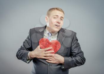 Man holding a red  heart concept for valentine's day, business customer care, charity, social and corporate responsibility
