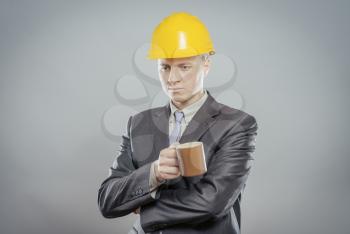 Workman holding a cup of coffee