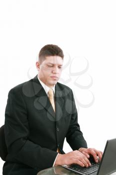 business man on a laptop in an office