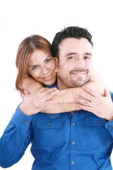 woman holding with love her boyfriend from behind, posing at camera 
