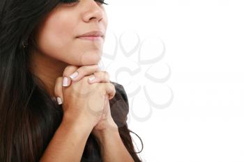 Closeup portrait of a young woman praying 
