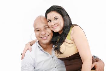 Portrait of a beautiful young happy smiling couple - isolated