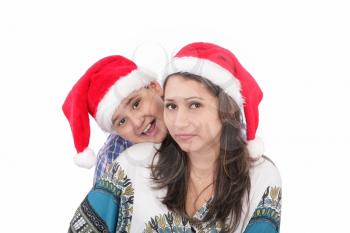 Cheerful boy and woman in Santa Claus hat. Isolated on white background