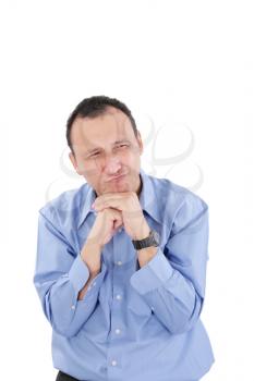 Closeup of frightened young man with funny facial expression against white background 
