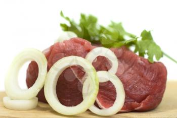 Royalty Free Photo of Meat on a Cutting Board