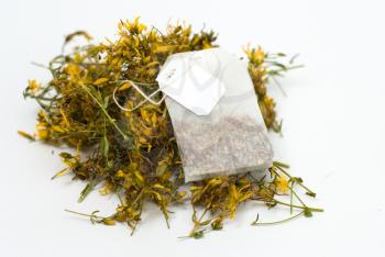 Royalty Free Photo of a Teabag and Flowers