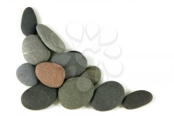 Round pebbles for a corner, over white
