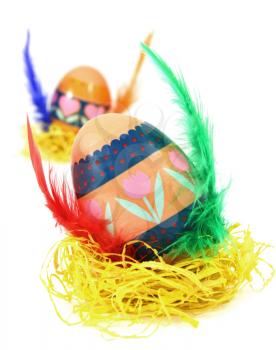 Easter egg race. Wings made of color feathers. Isolated on white.