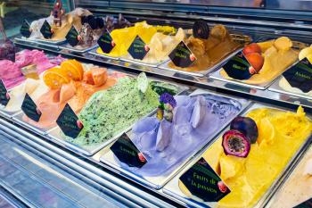 Flavors of colored ice cream on sale in the store in summer