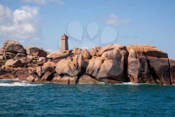 Lighthouse amongst pink granite boulders, ploumanach coast, Brittany, France