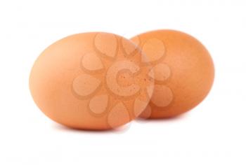 two brown chicken eggs isolated on white background