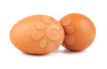 Pair of brown chicken eggs isolated on white background