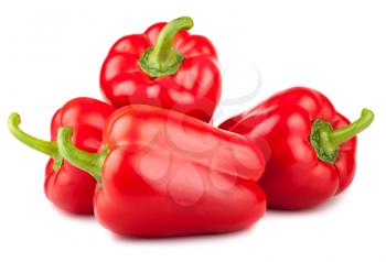 Four red sweet peppers isolated on white background