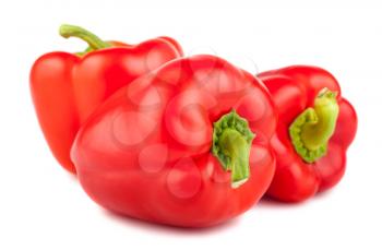 Three ripe sweet peppers isolated on white background