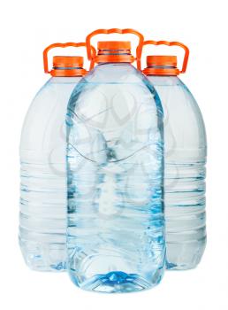 Three big full plastic water bottles with orange caps isolated on white background